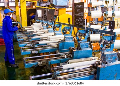 Johannesburg, South Africa - October 16, 2012: African Factory Worker On A Copwinder Weft Assembly Line Loom