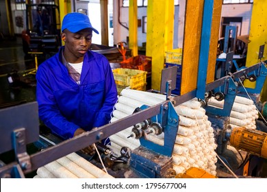 Johannesburg, South Africa - October 16, 2012: African Factory Worker On A Copwinder Weft Assembly Line Loom