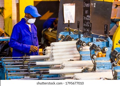 Johannesburg, South Africa - October 16, 2012: African Factory Worker On A Copwinder Weft Assembly Line Loom