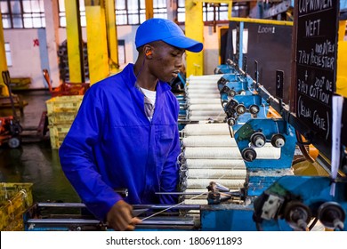 Johannesburg, South Africa - October 16, 2012: African Factory Worker On A Copwinder Weft Assembly Line Loom