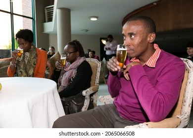 JOHANNESBURG, SOUTH AFRICA - Sep 30, 2021: A Group Of Diverse People At A Beer Tasting Event