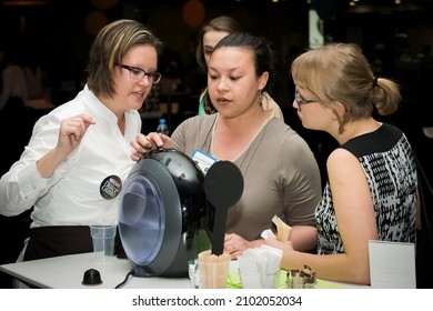 JOHANNESBURG, SOUTH AFRICA - Sep 30, 2021: A Group Of People Tasting Coffee At The Nescafe Dolce Gusto Product Launch Event In Johannesburg, South Africa