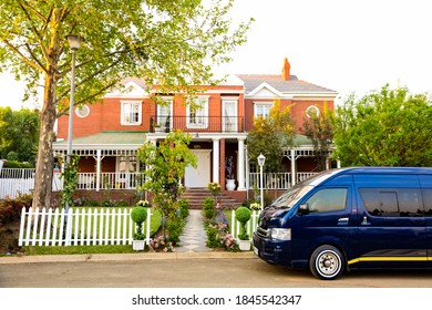 Johannesburg, South Africa - September 10, 2010: Minibus Taxi Van Parked Outside A House In A Wealthy Neighborhood 