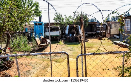 Johannesburg, South Africa, September 11, 2011, Scrapped Mini Bus Taxi In Garden Of Soweto Home 