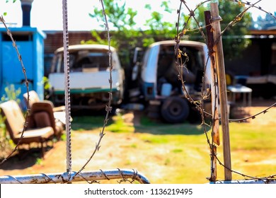 Johannesburg, South Africa, September 11, 2011, Scrapped Mini Bus Taxi In Garden Of Soweto Home 