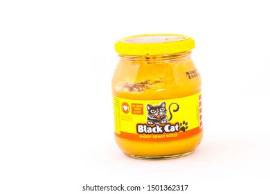 Johannesburg, South Africa - September 11, 2019: A Glass Jar Of Sugar Free Smooth Black Cat Peanut Butter Isolated On A White Background Image With Copy Space In Horizontal Format