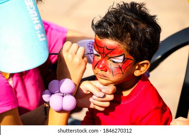 Johannesburg, South Africa - September 22, 2012: Young Indian Child Getting A Spiderman Face Paint Mask At Festival