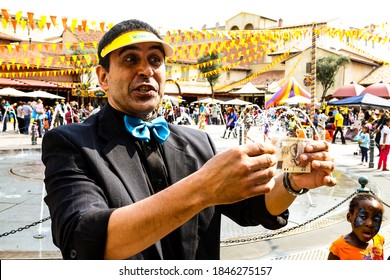 Johannesburg, South Africa - September 22, 2012: Street Magician Performing Tricks And Magic Show For Children At Funfair 