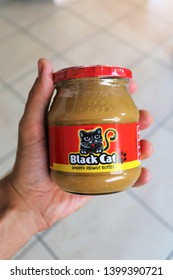 Johannesburg,South Africa.May 2019.A Glass Jar Of Black Cat Peanut Butter In Hand.This Is A South African Brand Of Peanut Butter.