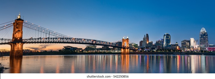John A. Roebling Suspension Bridge and Cincinnati skyline at night from across the Ohio River