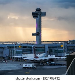 John F. Kennedy Airport (JFK) Air Traffic Control (ATC) Tower At Night As Seen From The TWA Hotel Open Pool Bar. Queens, New York, USA, October 2, 2019.