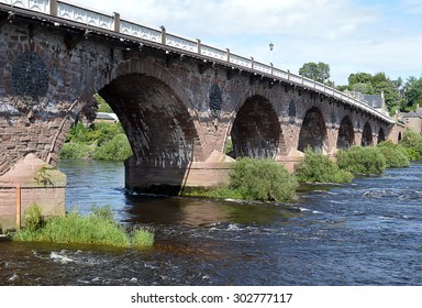 John Smeaton's nine arch masonry bridge (1766-71), the Auld Brig, over the River Tay in Perth, Scotland. 