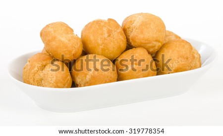 Johnny Cakes - Jamaican fried dumplings in a white bowl.