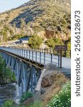 Johnsondale Bridge and River Trail Sign over Kern River with Trailhead Signage in Camp Nelson, California.