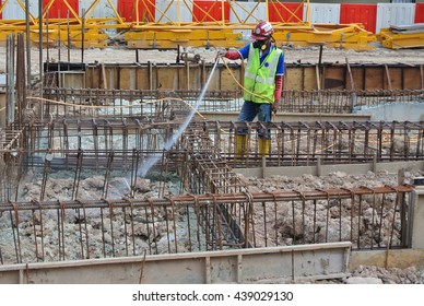 JOHOR, MALAYSIA -MARCH 29, 2016: Construction Workers Spraying The Anti Termite Chemical Treatment To The Soil At The Construction Site. 