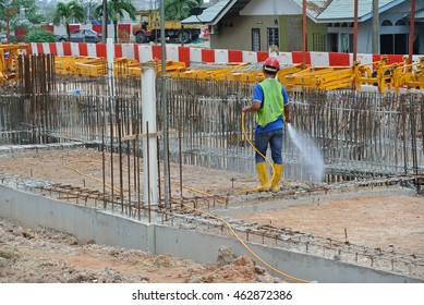 JOHOR, MALAYSIA -MARCH 29, 2016: Construction Workers Spraying The Anti Termite Chemical Treatment To The Soil At The Construction Site. 