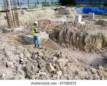 JOHOR, MALAYSIA -MARCH 29, 2016: Construction Workers Spraying The Anti Termite Chemical Treatment To The Soil At The Construction Site. 