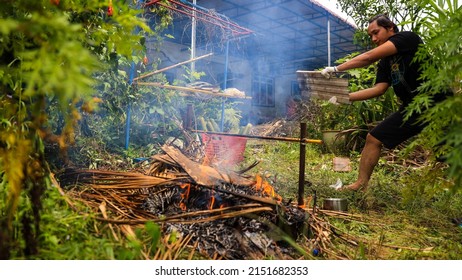 JOHOR, MALAYSIA-May 2, 2022: 
A Man Is Preparing A Food For First Day Of Aidilfitri. 