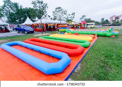 Johor,Malaysia - February 12,2020 : Outdoor Game Types For Family Day Event. Giant Soccer, Giant Snooker And Inflatable Game 