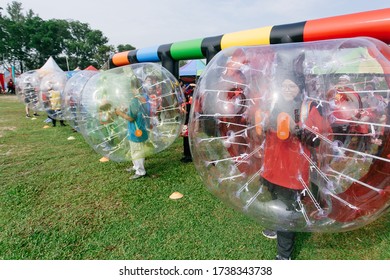 Johor,Malaysia - February 12,2020 : Outdoor Game Types For Family Day Event. Giant Soccer, Giant Snooker And Inflatable Game 