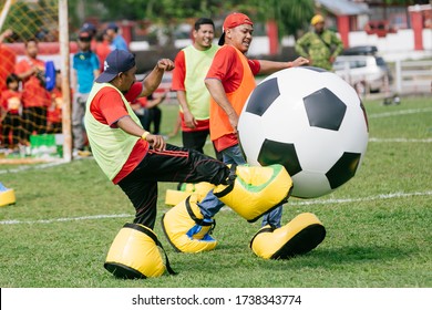 Johor,Malaysia - February 12,2020 : Outdoor Game Types For Family Day Event. Giant Soccer, Giant Snooker And Inflatable Game 