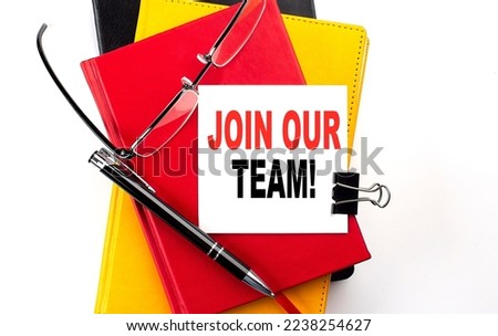 JOIN OUR TEAM text written on st icky on colorful notebooks