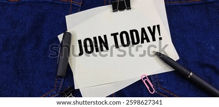 Join Today message on white paper clipped with black pen on denim fabric background, motivational sign-up concept, business invitation, recruitment, and membership promotion.
