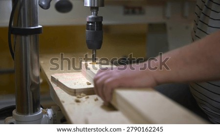 Joiner Operating Drill Press Skillfully. Woodworker Carefully Drilling Panels In Wellequipped Shop Space. Media