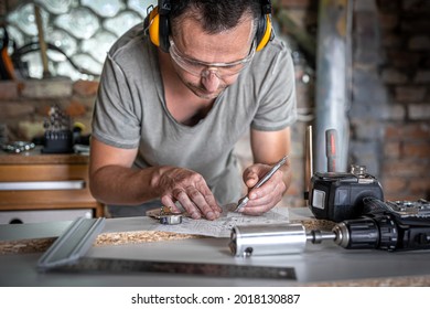Joiner in the process of work, measurements, drilling accuracy. - Shutterstock ID 2018130887