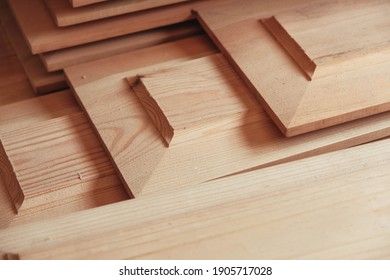 Joiner's boards from light natural wood are stacked on each other. Timber harvesting. Details of a lumber bar close-up. Hobbies of needlework, woodworking
