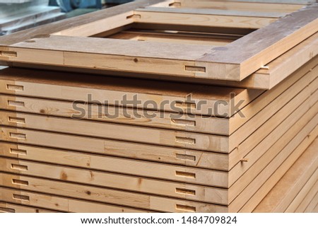 Joinery. Wood door manufacturing process. Stacked door leafs. Woodworking and carpentry production. Furniture manufacture. Close-up