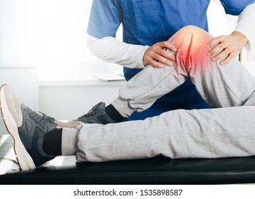 Joint, Knee And Leg Pain Treatment. Physiotherapist Exam Patient's Knee Close-up