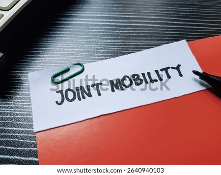 Joint mobility writting on table background.
