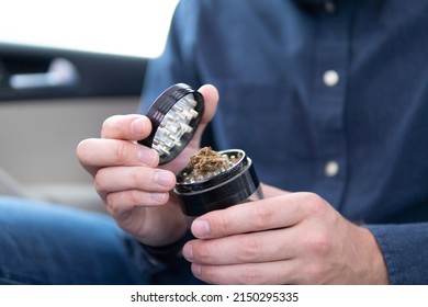 Joint Packet Of Weed On A Car Background Close Up Marijuana Joint In Hand Bud Flowers