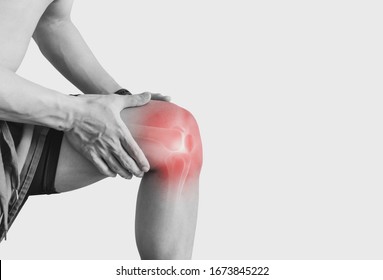 Joint pain, Arthritis and tendon problems. a man touching nee at pain point, on white background - Shutterstock ID 1673845222