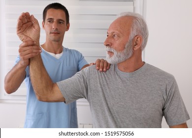 Joint Problems, Arthritis Health And Aging. Chiropractic / Osteopathy Treatment, Elbow Joint Pain. Physiotherapy For Senior Male Patient