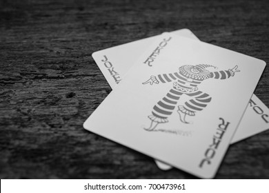 Joker card on wooden floor,Black and white pictures - Shutterstock ID 700473961