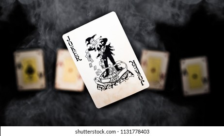 Joker and four aces in the smoke  - Shutterstock ID 1131778403