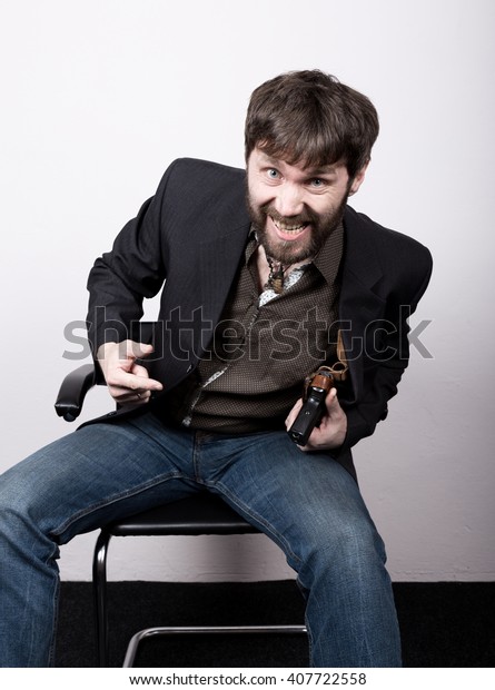 jolly bearded man in a jacket and\
jeans, sitting on a chair and holding a gun. gangster concept.\
Negotiations went not on the script, Dangerous\
Liaisons