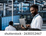 Jolly data center software developer monitoring system performance with laptop, identifying bottlenecks. Joyous server farm IT professional troubleshooting glitches, implementing optimizations