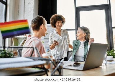 Jolly diverse businesswomen discussing ideas at desk in modern office. - Powered by Shutterstock