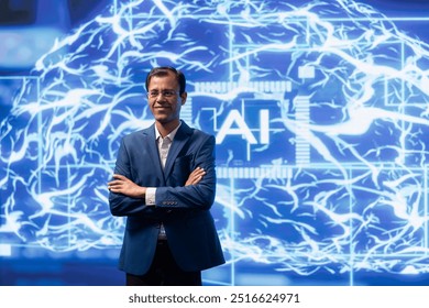 Jolly engineer using artificial intelligence computing simulating human brain thought processes. Portrait of upbeat Indian employee working with AI machine learning algorithms