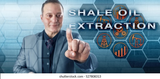 Jolly Male Petroleum Industrialist With Toothless Smile Is Pushing SHALE OIL EXTRACTION On An Interactive Control Screen. Oil And Gas Industry Metaphor For Unconventional Oil Production Processes.