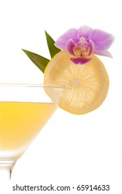 Jolly Rancher Martini With Raspberry Vodka, Sour Apple Liqueur, Raspberry Liqueur, Banana Liqueur, Red Cranberry Juice Decorated With Lemon Wheel And Orchid Isolated On A White Background