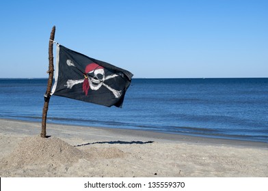 Jolly Roger Pirate flag blowing in the wind.