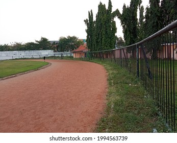 Jombang East Java On June 21, 2021-Jogging Track At Merdeka Jombang Stadium And A Soccer Field With A Guardrail That Surrounds It