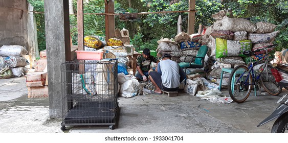 Jombang, Indonesia - March 10th, 2020 - The Process Of Collecting Plastic Waste From Floods For Recycling Preparation