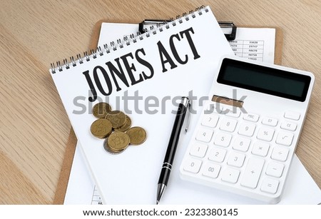 JONES ACT text with chart and calculator and coins , business