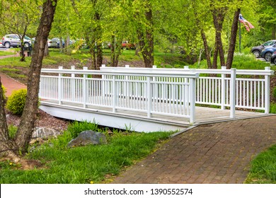 JONESBOROUGH, TN, USA-4/28/19: An Elegant White Footbridge Crossing A Dry Creek In Jimmy Neil Smith Park.