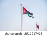 Jordan flag with clear blue sky in the background